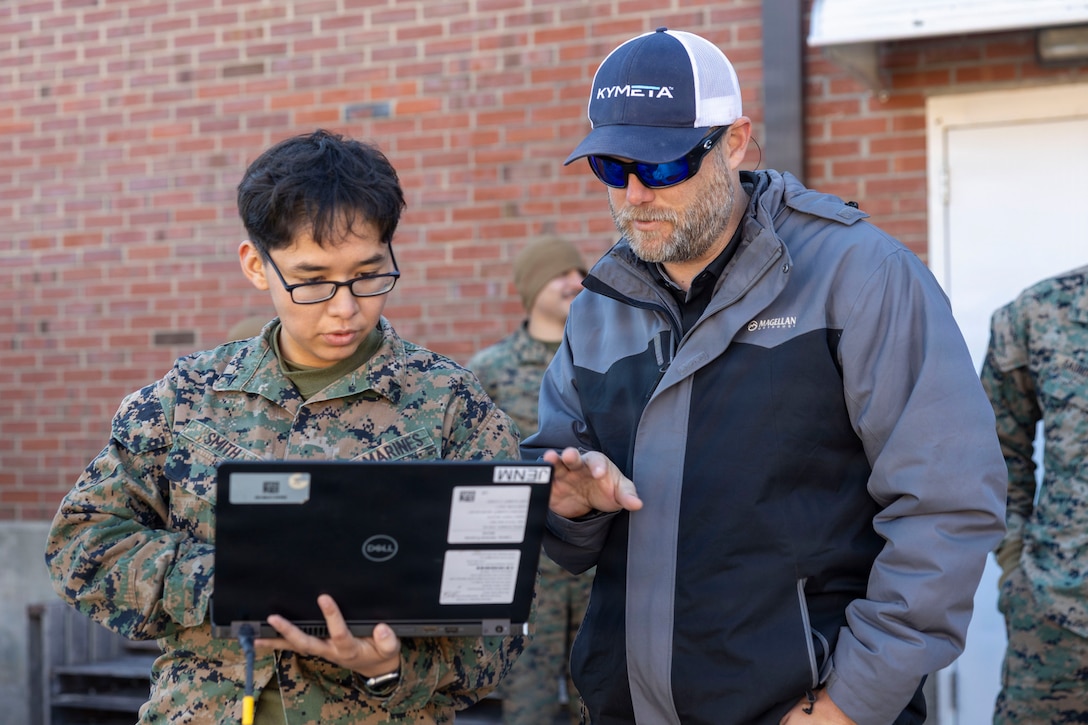 Brad Browning, right, a senior solutions engineer with Kylmeta, assists U.S. Marine Corps Lance Cpl. Celeste Smith, a data systems administrator with 8th Communications Battalion, II Marine Expeditionary Force Information Group, II MEF, operate an osprey hybrid GEO\LEO during a Satellite Communications Operator Course at Marine Corps Base Camp Lejeune, Dec. 16, 2025. The purpose of CSOC is to provide knowledge and hands on training with commercial off-the-shelf communication equipment to modernize communication efforts in accordance with Force Design. Smith is a native of Arizona. (U.S. Marine Corps photo by Lance Cpl. Isabella Ramos)