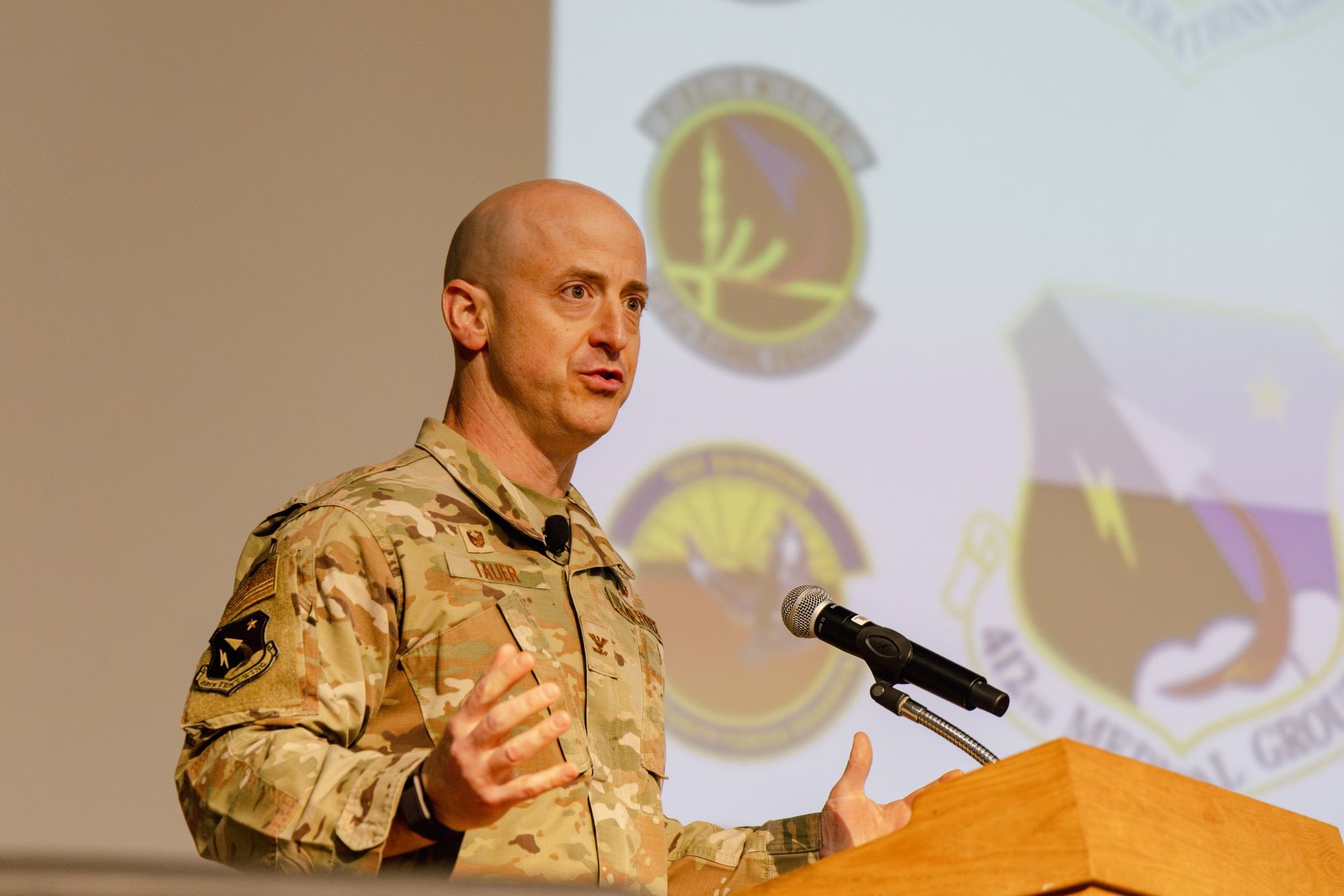 Col. Tom Tauer, 412th Test Wing commander, rolled out shorter, more memorable and, perhaps, more emotionally charged wing mission and vision statements during Tuesday’s “Back-in-the-Saddle” All Call in the base theater. (Photo by Brandon Hernandez)