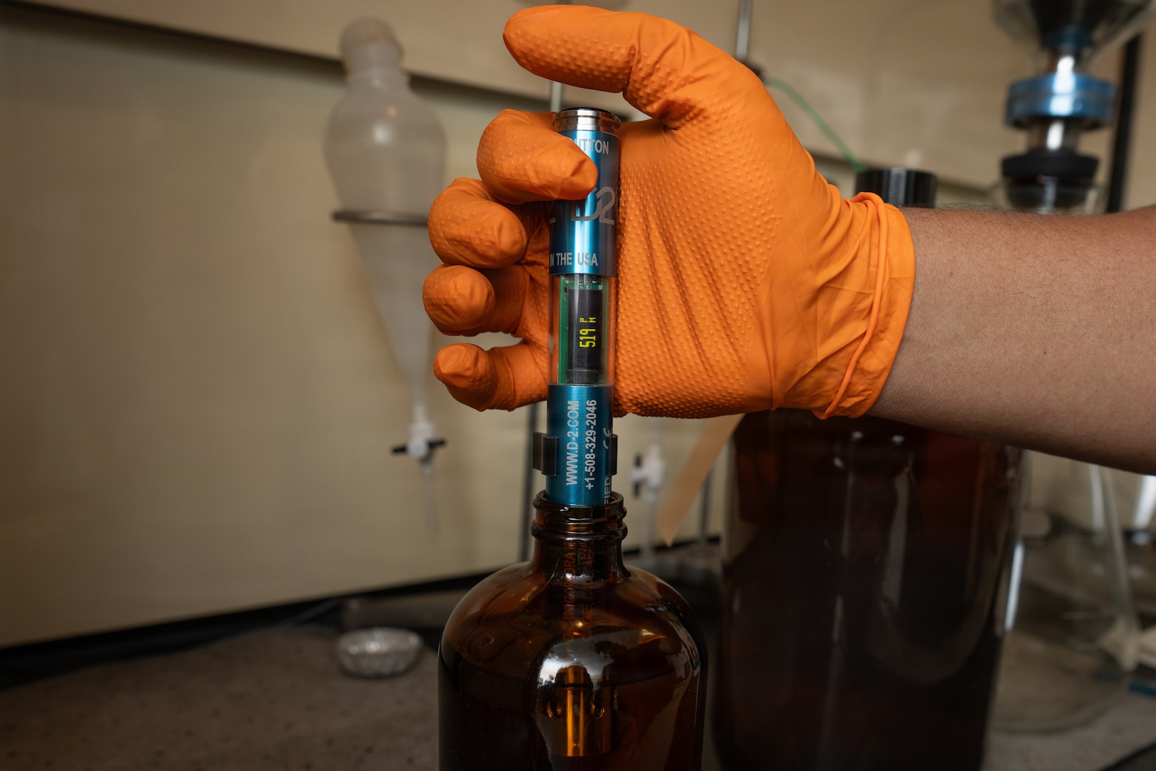 A fuel sample is tested using a conductivity stick at Joint Base San Antonio-Lackland, Texas, Jan. 6, 2026. The test ensures the presence of static dissipator additive, which prevents the buildup of static electricity during aircraft refueling operations. Fuels Flight personnel with the 502d Logistics Readiness Squadron verify conductivity levels as part of routine quality control checks. (U.S. Air Force photo by Jonathan R. Mallard)