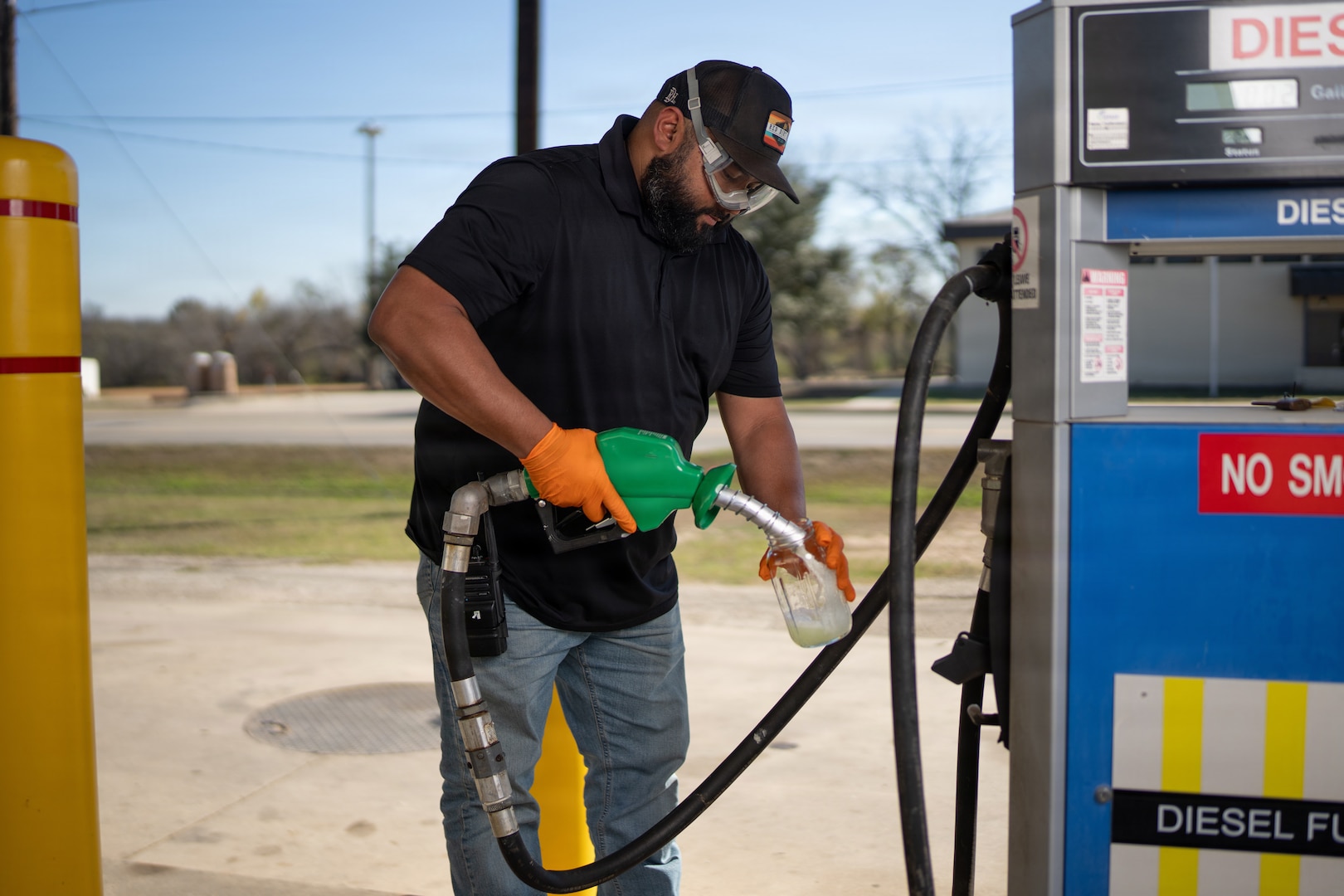 Rogelio Guerrero, 502d Logistics Readiness Squadron Fuels Flight quality assurance specialist, draws a diesel fuel sample for inspection at Chapman Training Annex, Joint Base San Antonio-Lackland, Texas, Jan. 6, 2026. Fuels personnel conduct visual sampling every 45 days to check for water or sediment and ensure fuel quality at service stations across JBSA. (U.S. Air Force photo by Jonathan R. Mallard)