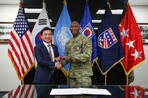 U.S. Army Gen. Xavier Brunson, commander of United Nations Command, Republic of Korea-U.S. Combined Forces Command and U.S. Forces Korea, presents a commemorative gift to Republic of Korea Minister of National Defense Ahn Gyu-back during a visit to Camp Humphreys, Republic of Korea, Jan. 6, 2026.