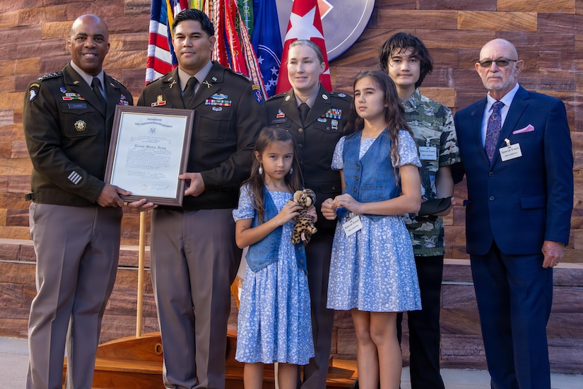 .S. Army Cpt. Jeremy Chambers, of U.S. Army Pacific, celebrate a rare and powerful milestone with his family, friends, and mentors during the promotion of Cpt. Jeremy Chambers from Master Sargent to Captain, Dec. 4, 2025, Fort Shafter, Hawaii.
