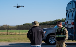 Two airmen fly a small UAS.