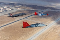 A T-7A Red Hawk from the 416th Flight Test Squadron, F-35A from the Alabama Air National Guard and P-51D Mustang from the Palm Springs Air and Space Museum fly in formation over Edwards Air Force Base after the 2025 Red Tail Rendezvous event.