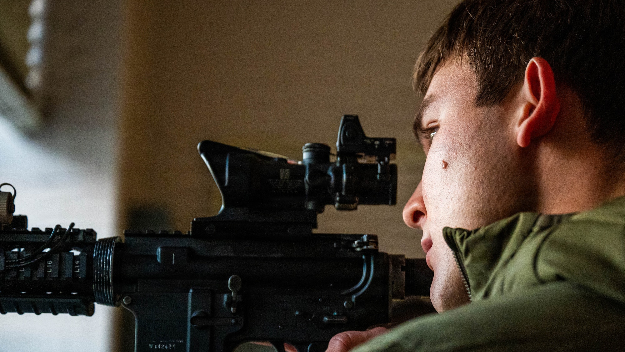 Airman sights down and M4