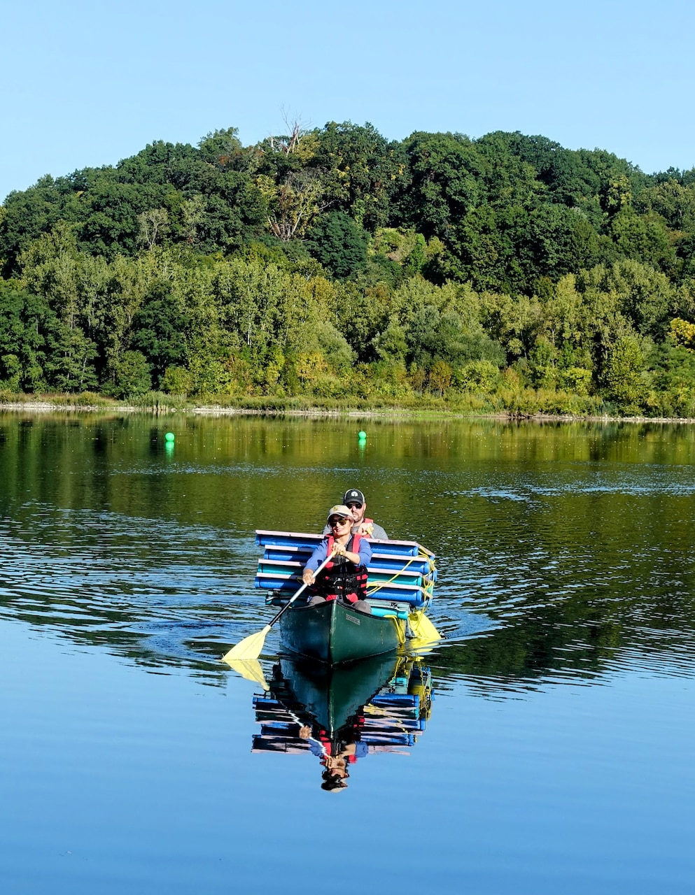 The U.S. Naval Research Laboratory (NRL) launched a groundbreaking remote sensing experiment, Coastal Hyperspectral Reflectance Object Material Analysis (CHROMA), Sept. 4-19, 2025, designed to accelerate the application of artificial intelligence (AI) in hyperspectral imaging and strengthen environmental intelligence and resource management capabilities across the Department of War and the wider scientific community. NRL’s CHROMA Project Lead Katarina Doctor, Ph.D., and Scott Ramsey, Head of the NRL Signature Technology Office deliver coated panels by boat for placement on the water.  The hands-on effort was critical for positioning targets for airborne and satellite data collection. (Photo by Cécile Darviot, DRDC)