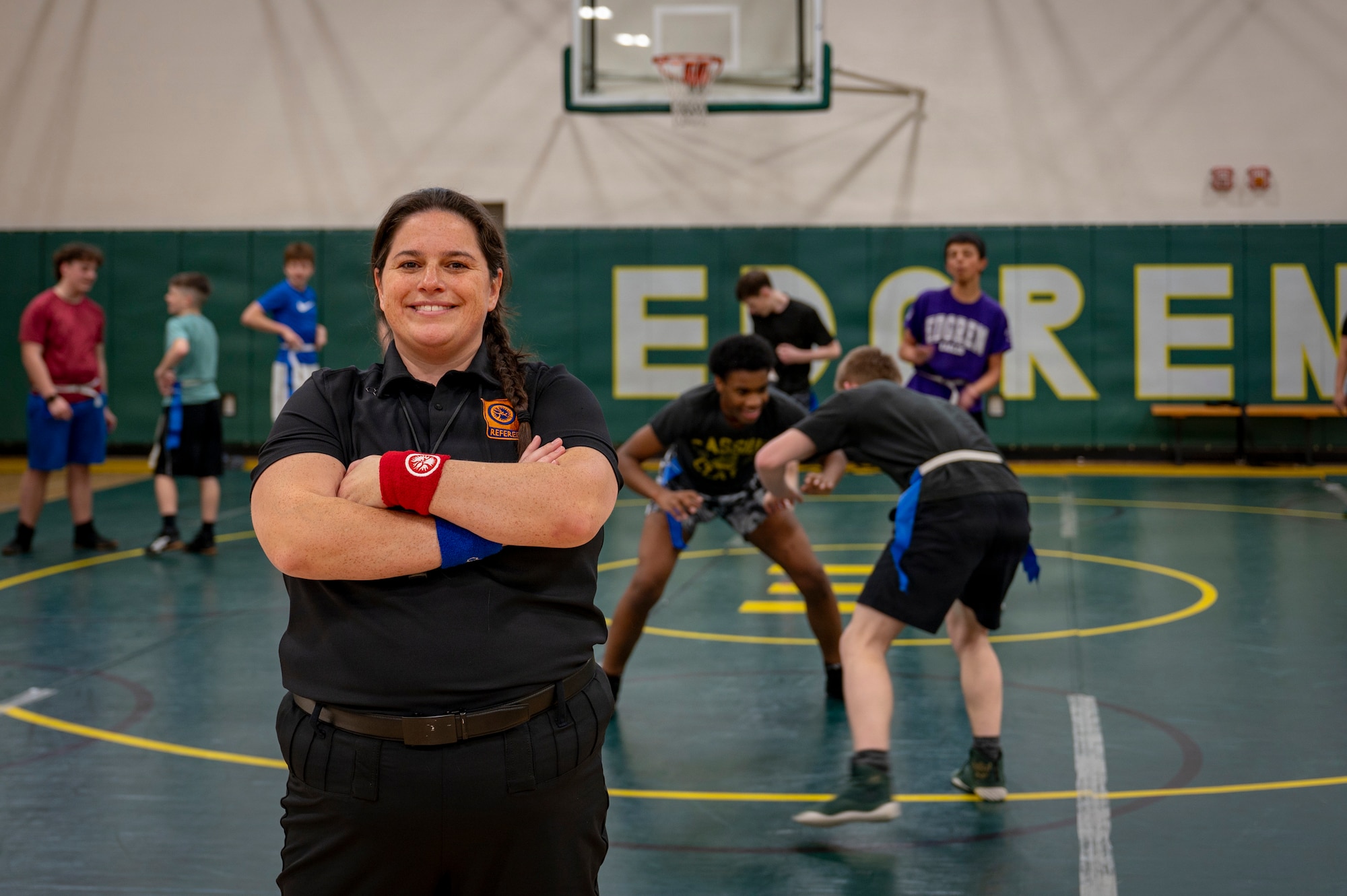 Laura Lopez-Cepero, 35th Fighter Wing spouse and international wrestling referee, poses for a photo during wrestling practice at Misawa Air Base, Japan, Jan. 7, 2026. She regularly supports the base community through school athletics while also engaging with host-nation partners through sport, including a recent invitation to officiate Japan’s national wrestling team trials. (U.S. Air Force photo by Senior Airman Brittany Russell)