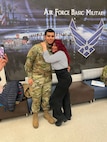 Photo of an Air Force Airman with his mother during basic military training.