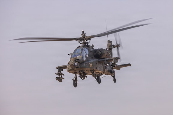 A U.S. Army AH-64D Apache assigned to Task Force Shikra (3-4 AHB), 4th Combat Aviation Brigade prepares to engage targets during Exercise Sky Shield at the Udari Range Complex, Kuwait, Dec. 5, 2025. Led by Kuwait, exercise Sky Shield included participation from the United States, Bahrain, and the United Kingdom. (U.S. Army Photo by Joe Kumzak)
