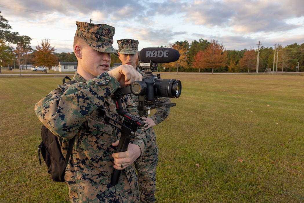 U.S. Marine Corps Lance Cpl. Brant Cushman, a combat videographer with Marine Corps Combat Service Support Schools, and a native of Beaufort, South Carolina, documents Marines prior to a formation run on Camp Gilbert H. Johnson, North Carolina