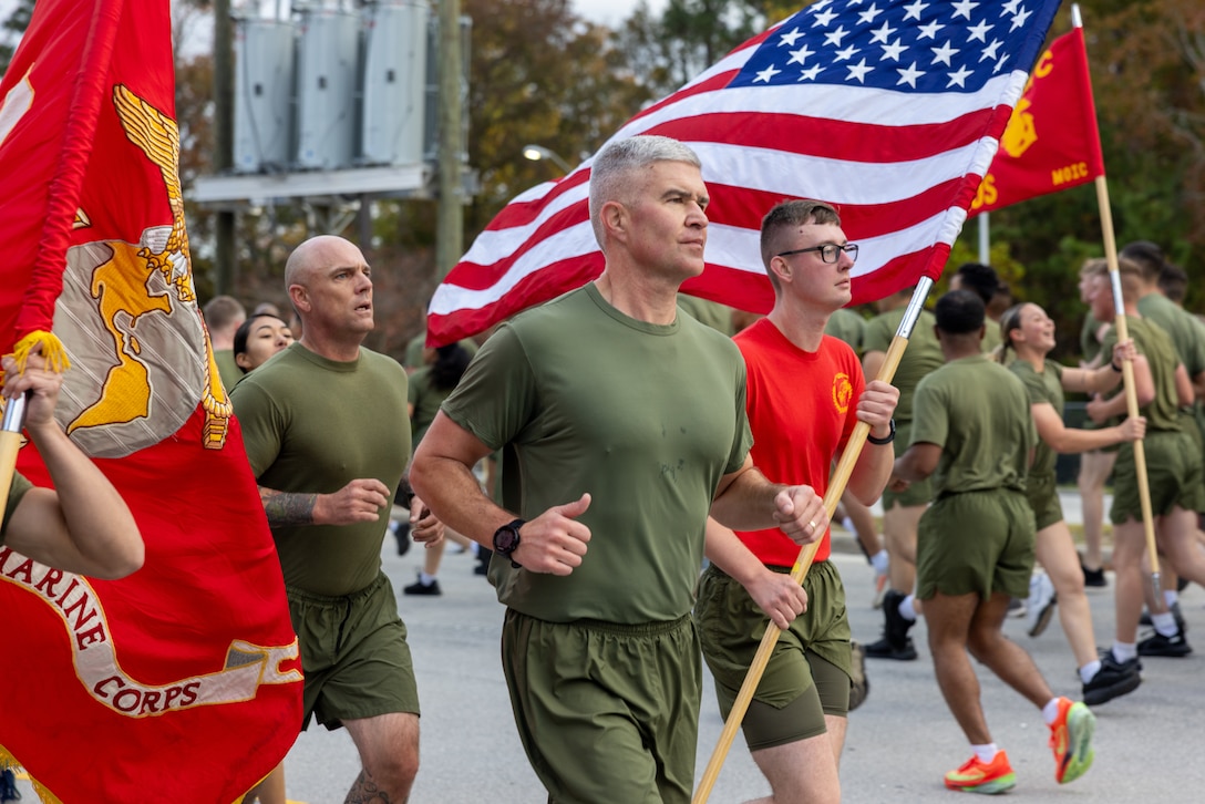 U.S. Marine Corps Col. Scott Benninghoff, the commanding officer of Marine Corps Combat Service Support Schools, and a native of Indiana, participates in a formation run on Camp Gilbert H. Johnson, North Carolina,