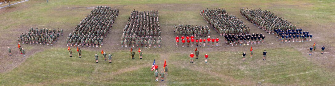 U.S. Marines with Marine Corps Combat Service Support Schools stand in formation prior to a formation run on Camp Gilbert H. Johnson, North Carolina,