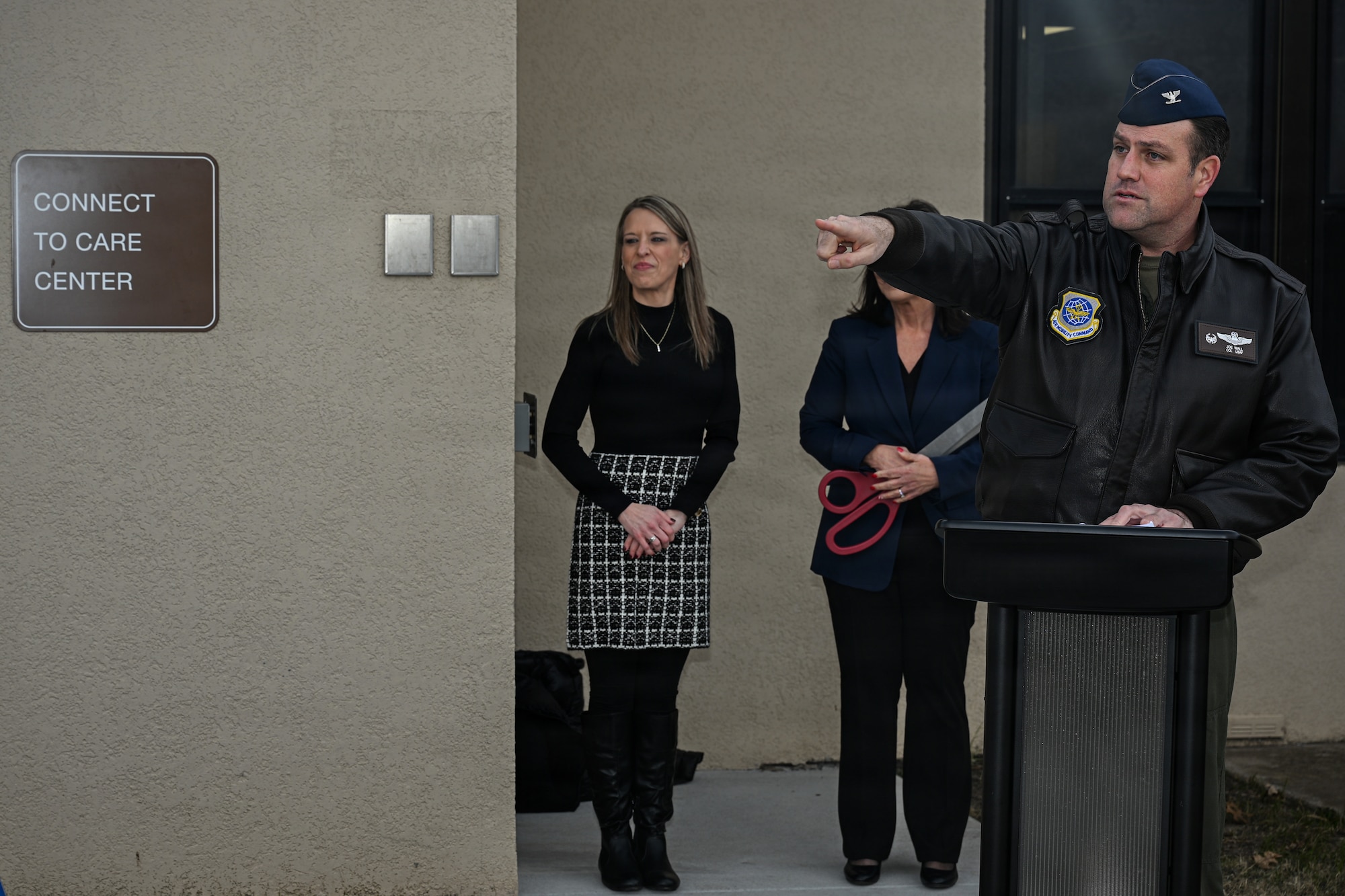 Col. Joe Wall, 22nd Air Refueling Wing commander, delivers remarks during a ribbon cutting ceremony at McConnell Air Force Base, Kansas, Dec. 19, 2025. Wall gave a brief speech to commemorate the opening of a new connect to care facility.  (U.S. Air Force photo by Senior Airman Amelio Brown)