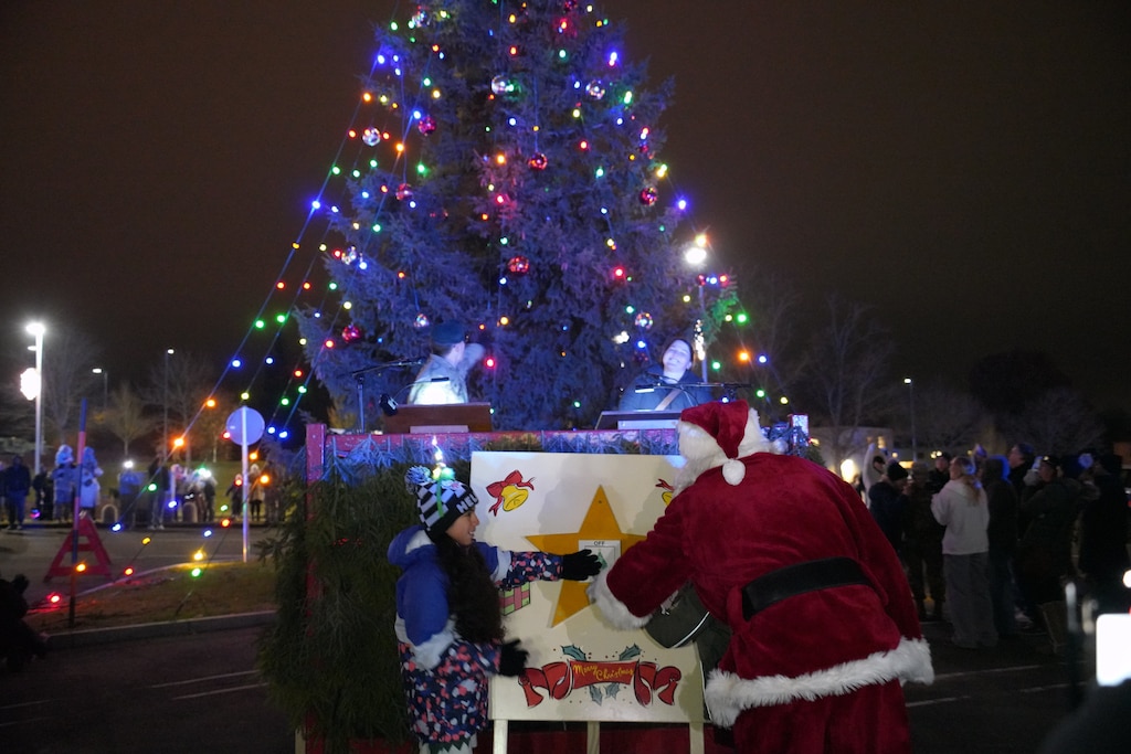 During the official lighting of the holiday tree the community did a countdown to turn the switch to light up the night. At each location two little helpers assisted Santa and Nikolaus in lighting the holiday tree. (Photo Credit: Ella Haendel, USAG Bavaria Public Affairs)