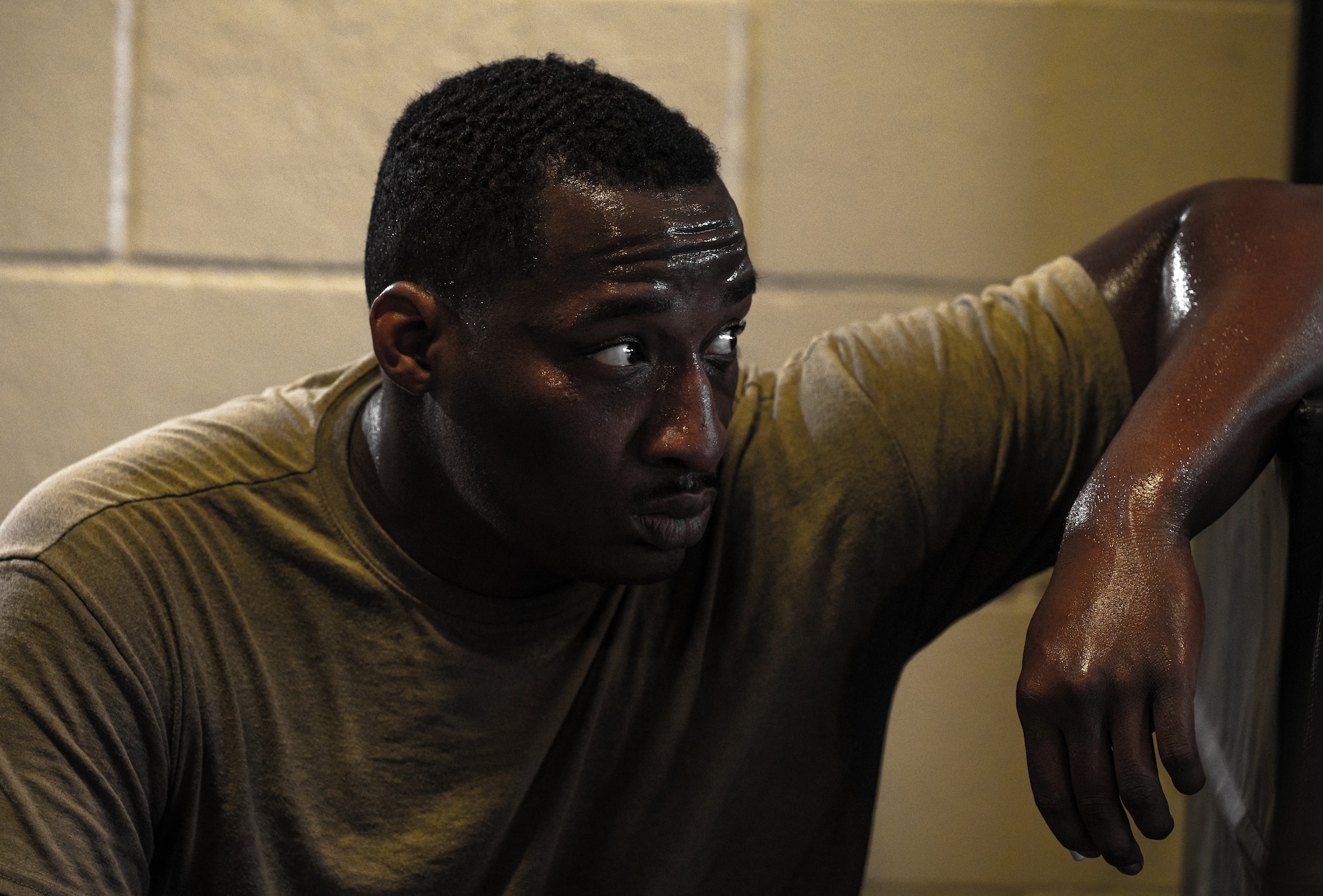 U.S. Air Force Staff Sgt. Tymalik Garrison, 335th Fighter Generation Squadron weapons quality assurance inspector, recovers from an Armament Fitness Assessment (AFA) at Seymour Johnson Air Force Base, North Carolina, Oct. 8, 2025. When maintaining F-15E Strike Eagles, airmen must be in peak physical condition to meet the demands of combat operations. (U.S. Air Force photo by Airman Holly Leonard)