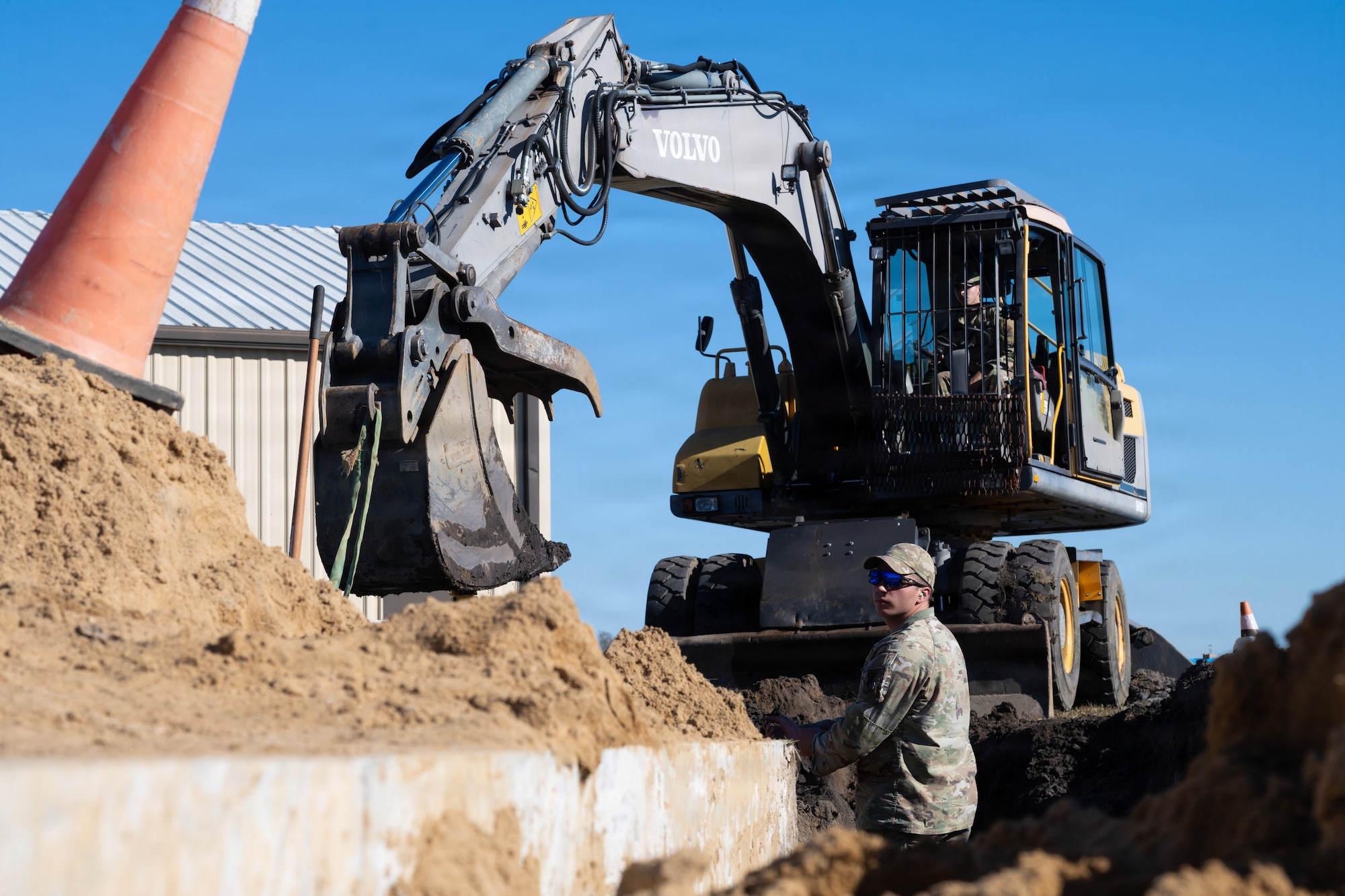 U.S. Air Force Senior Airman Benjamin Berberich, 4th Civil Engineer Squadron pavement and equipment journeyman, prepares to replace a water line at Seymour Johnson Air Force Base, North Carolina, Nov. 17, 2025. The water line replacement project introduces tougher piping that enhances both reliability and efficiency. (U.S. Air Force photo by Airman Daryl Briscoe)