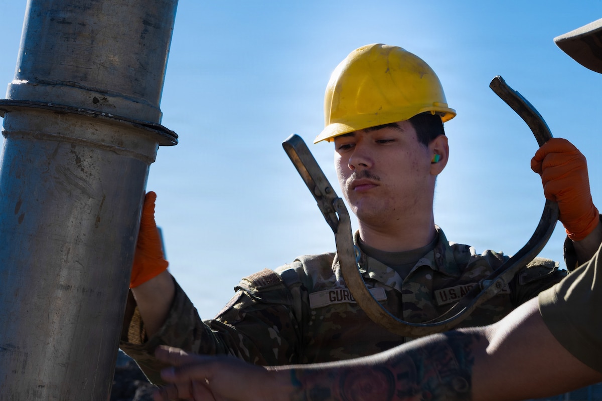 U.S. Air Force Airman 1st Class Christopher Gurule, 4th Civil Engineer Squadron water and fuel systems maintenance apprentice, removes a part from a water pipe at Seymour Johnson Air Force Base, North Carolina, Nov. 17, 2025. The new high-strength material will ensure reliable water delivery and improved system performance across the base for years to come. (U.S. Air Force photo by Airman Daryl Briscoe)