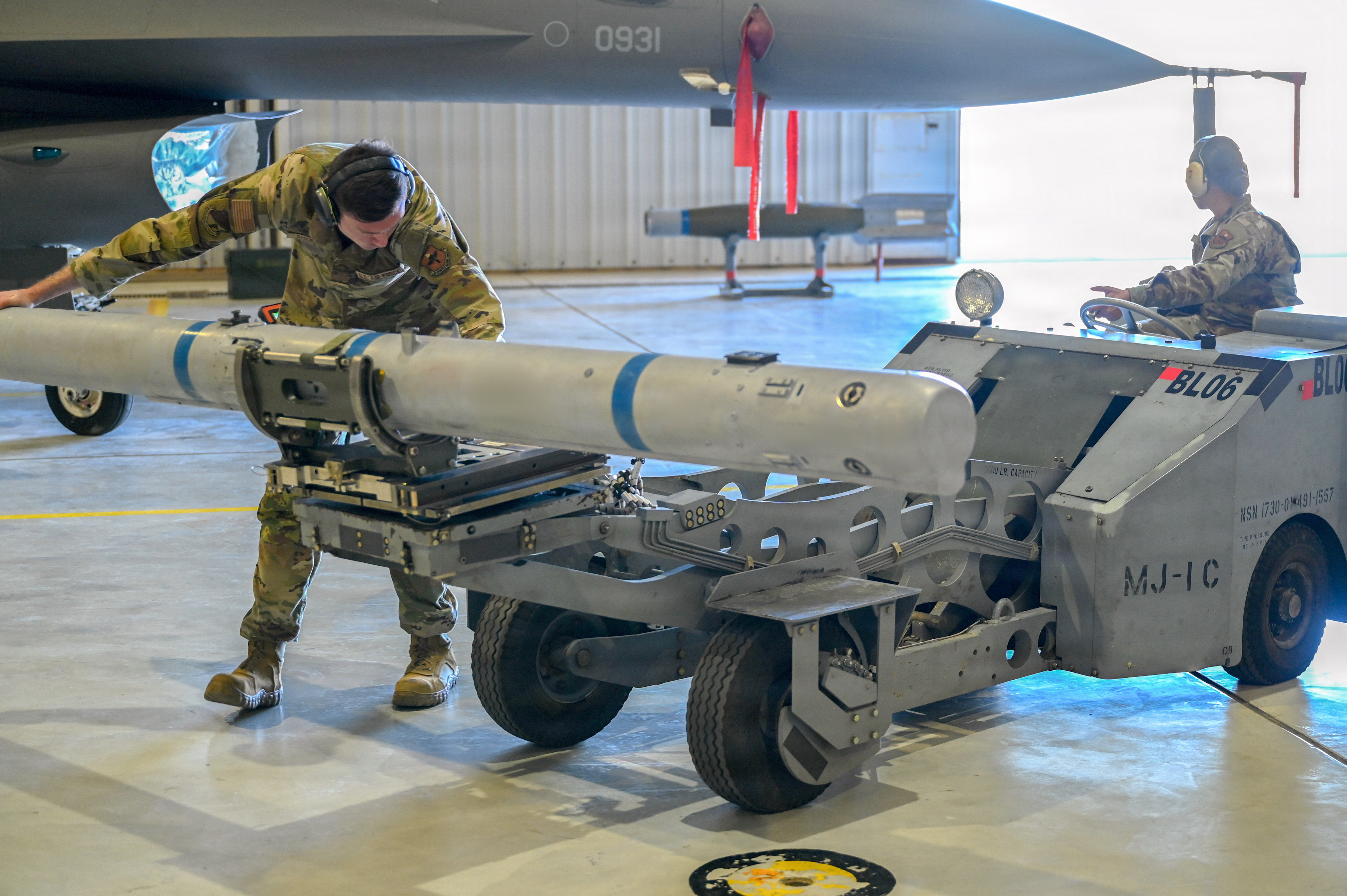 849th-aircraft-maintenance-squadron-airmen-load-weapons-onto-f-16