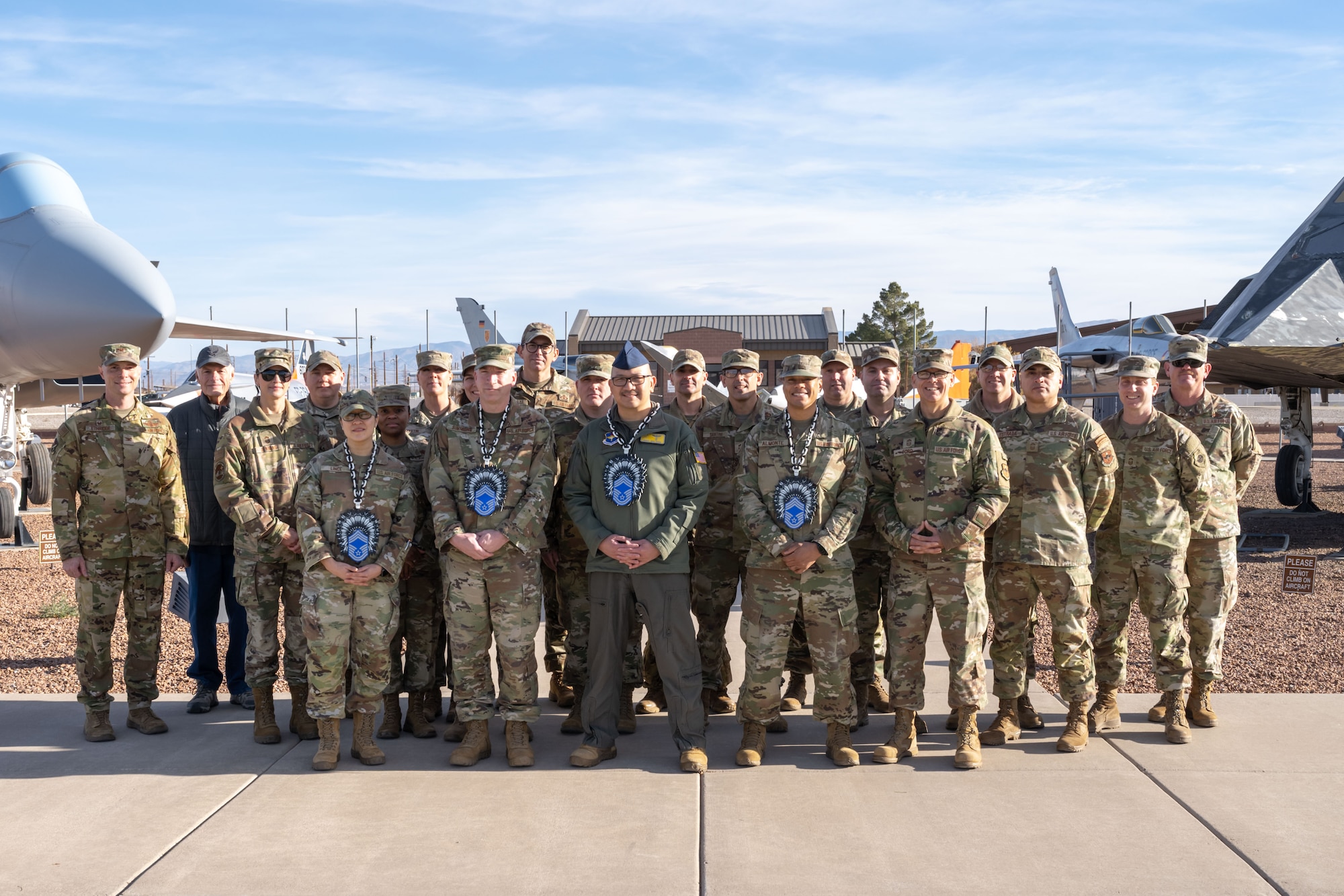 New chief master sergeant selects pose for a photo with 49th Wing leadership at Heritage Park on Holloman Air Force Base, New Mexico, Jan. 6, 2026.