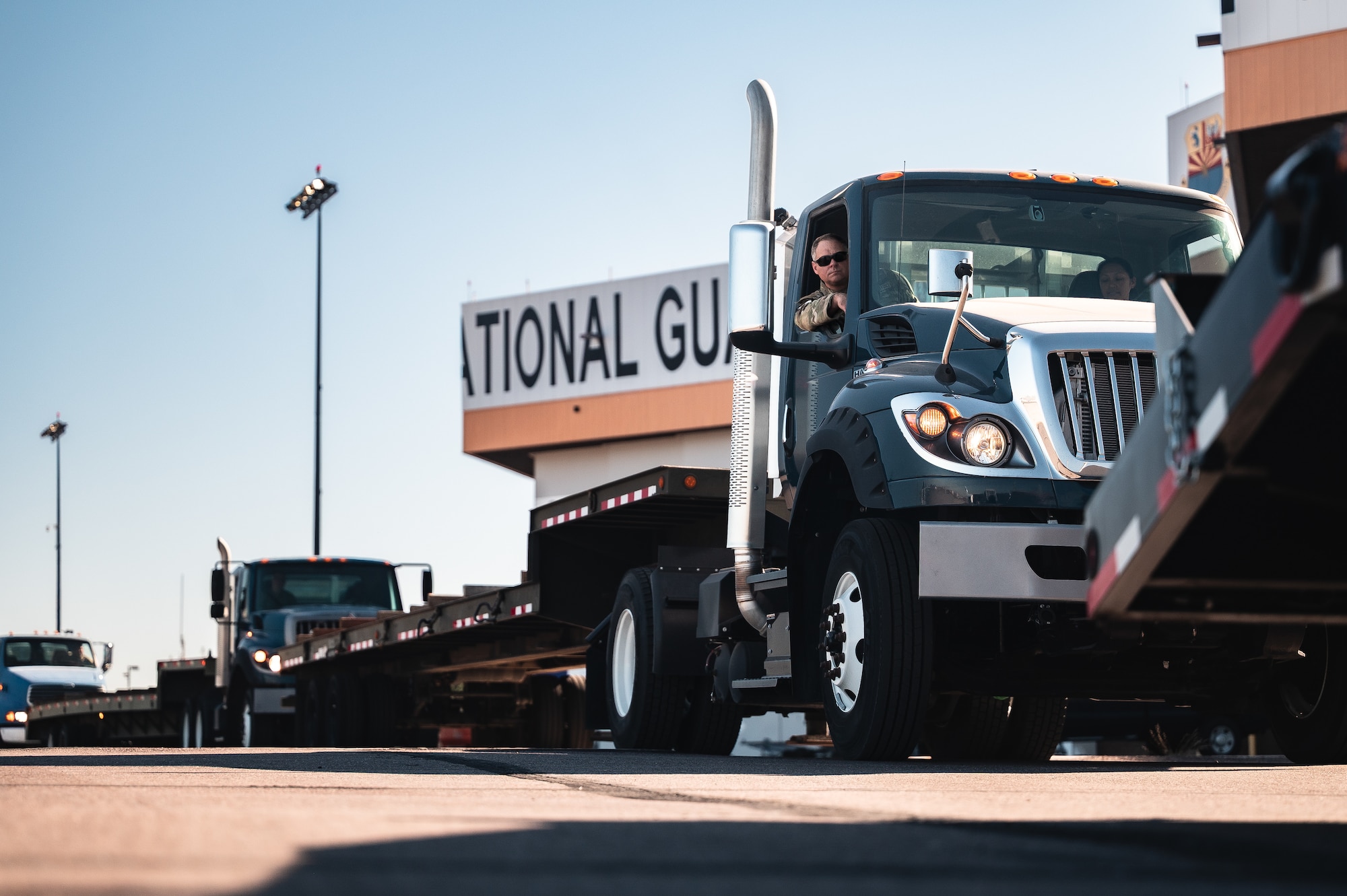 U.S. Air Force Airmen assigned to the 56th Fighter Wing and the 161st Logistics Readiness Squadron operate K-Loaders to transport munitions cargo from a Boeing 747 during a Special Assignment Airlift Mission