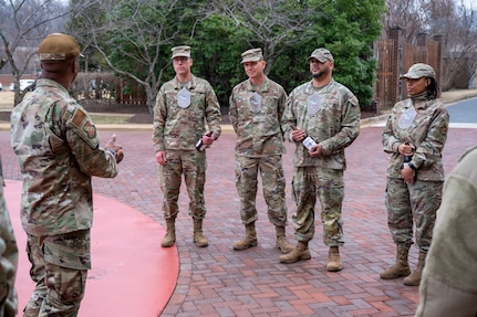 Newly selected chief master sergeants and wing leadership from Joint Base Anacostia-Bolling gather for a photo on JBAB, Washington, D.C., Jan. 6, 2026. Chief master sergeant, the highest U.S. Air Force enlisted rank, is held by just 1% of the Air Force's enlisted personnel. (U.S. Air Force photo by Hayden Hallman)