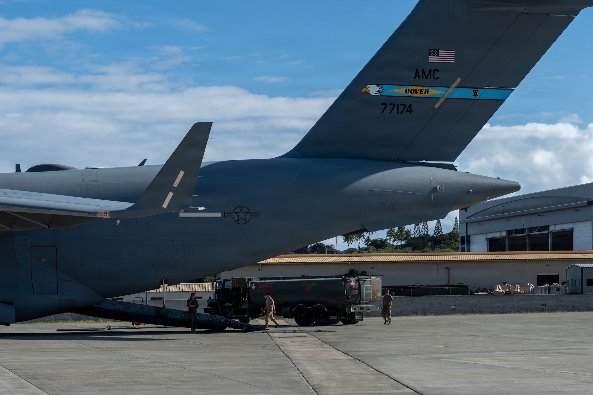Members of the 154th Wing and 436th Airlift Wing unload a fuel truck from a C-17 Globemaster III during an Integrated Combat Turn in support of exercise Joint Pacific Multinational Readiness Center 26-1 at Marine Corps Base Hawaii, Hawaii, Nov. 6, 2025. Exercise JPMRC 26-01 is a large-scale joint and multinational exercise designed to train units and leaders in the region’s complex and austere jungle, arctic, and archipelago environments, replicating real-world conditions. JPMRC is a key way the Army contributes to Integrated Deterrence and regional security in the Indo-Pacific, training thousands of combat credible forces in the region.