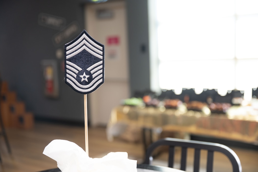 A chief master sergeant rank insignia on top of a cake during the chief master sergeant release party at the Powell Event Center, Goodfellow Air Force Base, Texas, Jan. 6, 2026. During the 2025 promotion cycle, 640 of 2,445 senior master sergeants were selected for promotion to chief master sergeant, representing a 26.18% selection rate across the Air Force. (U.S. Air Force photo by Airman 1st Class James Salellas)