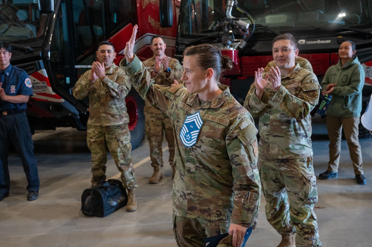 Senior Master Sgt. Heather Clifton, 312th Training Squadron superintendent, waves to members of the 17th Training Wing during the chief master sergeant release party, at the Louis F. Garland Fire Academy, Goodfellow Air Force Base, Texas, Jan. 6, 2026. Chief master sergeants are responsible for translating senior leaders' guidance into actionable tasks while developing and mentoring the next generation of Airmen. (U.S. Air Force photo by Airman 1st Class James Salellas)