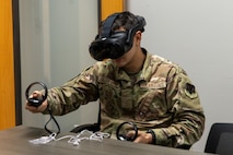 U.S. Air Force Airman Antonio Casillas-Tapia, 13th Intelligence Squadron all source intelligence analyst, uses virtual reality (VR) headgear installed with Moth+Flame programming while taking a professional development course at Recce-U, December 12, 2025, at Beale Air Force Base, California.