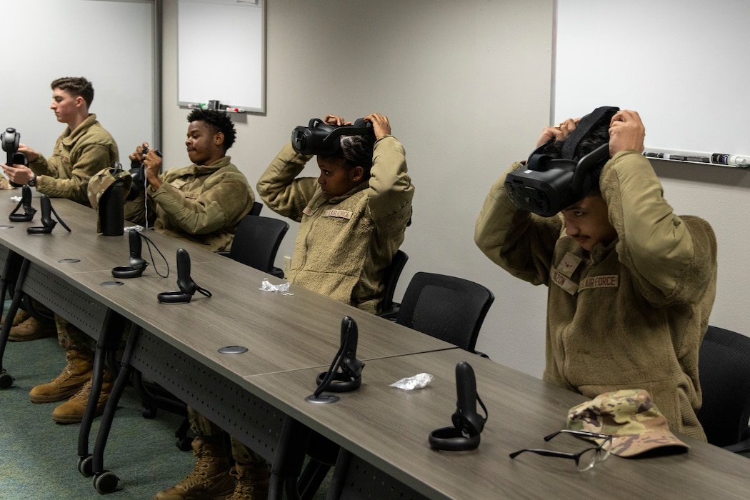 U.S. Air Force Airmen taking a professional development course at Recce-U use virtual reality (VR) headgear installed with Moth+Flame programming December 12, 2025, at Beale Air Force Base, California.