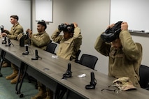U.S. Air Force Airmen taking a professional development course at Recce-U use virtual reality (VR) headgear installed with Moth+Flame programming December 12, 2025, at Beale Air Force Base, California.