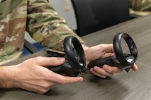 U.S. Air Force Airman 1st Class Scott Patterson, 9th Maintenance Squadron aircraft structural maintenance specialist, uses virtual reality (VR) headgear installed with Moth+Flame programming while taking a professional development course at Recce-U, December 12, 2025, at Beale Air Force Base, California.