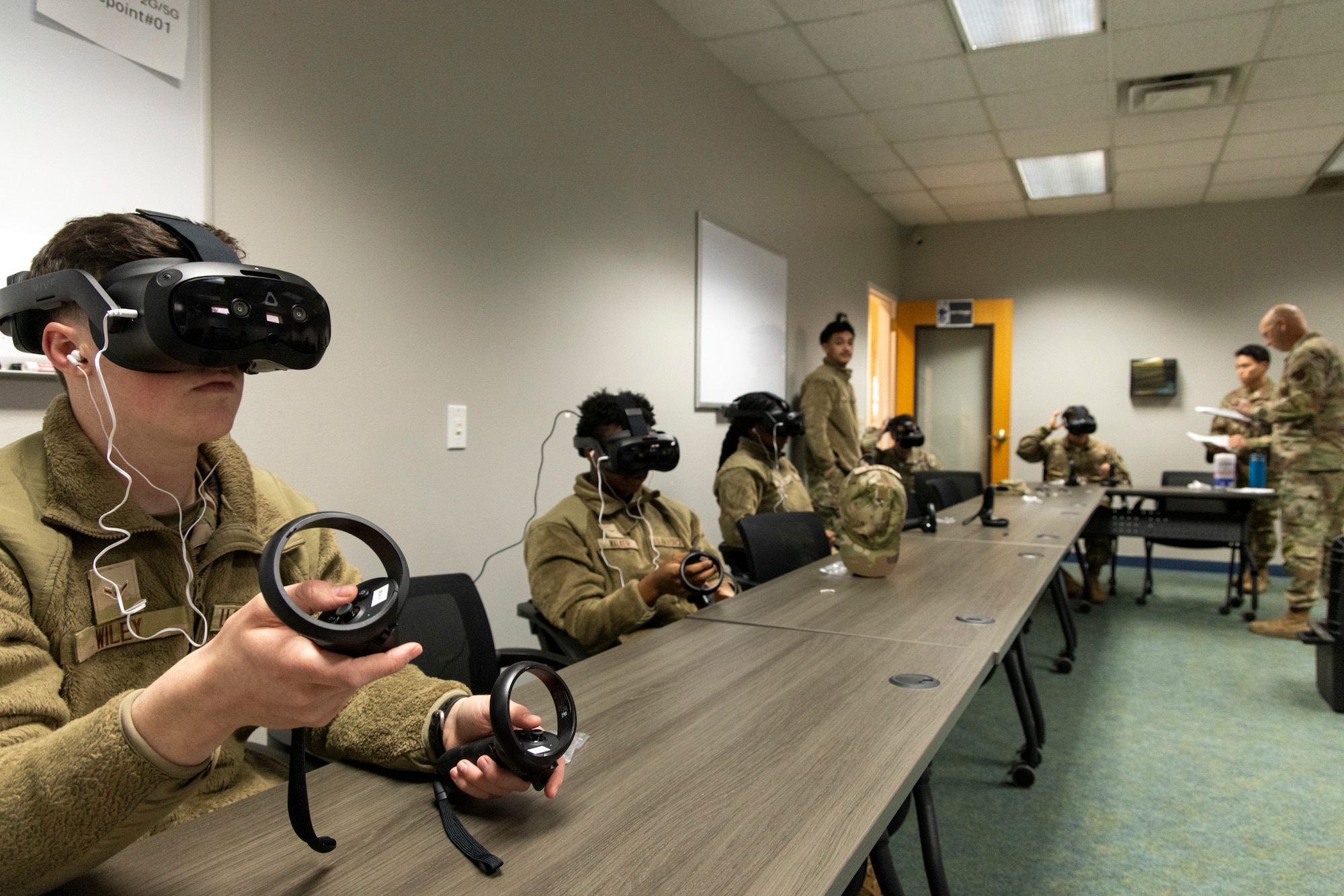 U.S. Air Force Airmen taking a professional development at Recce-U use virtual reality (VR) headgear installed with Moth+Flame programming December 12, 2025, at Beale Air Force Base, California.