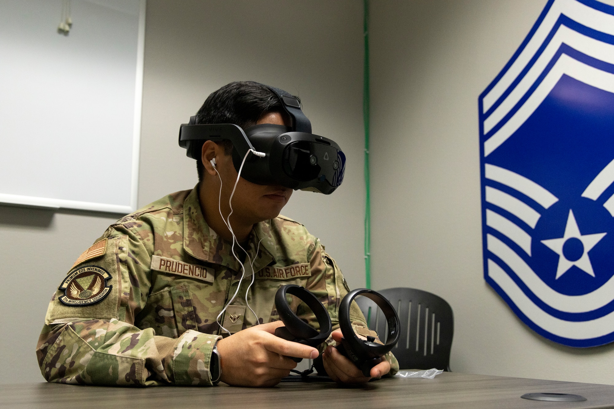 U.S. Air Force Airman Jeremy Prudencio, 13th Intelligence Squadron cryptologic analyst and reporter, uses virtual reality (VR) headgear installed with Moth+Flame programming while taking a professional development course at Recce-U, December 12, 2025, at Beale Air Force Base, California.