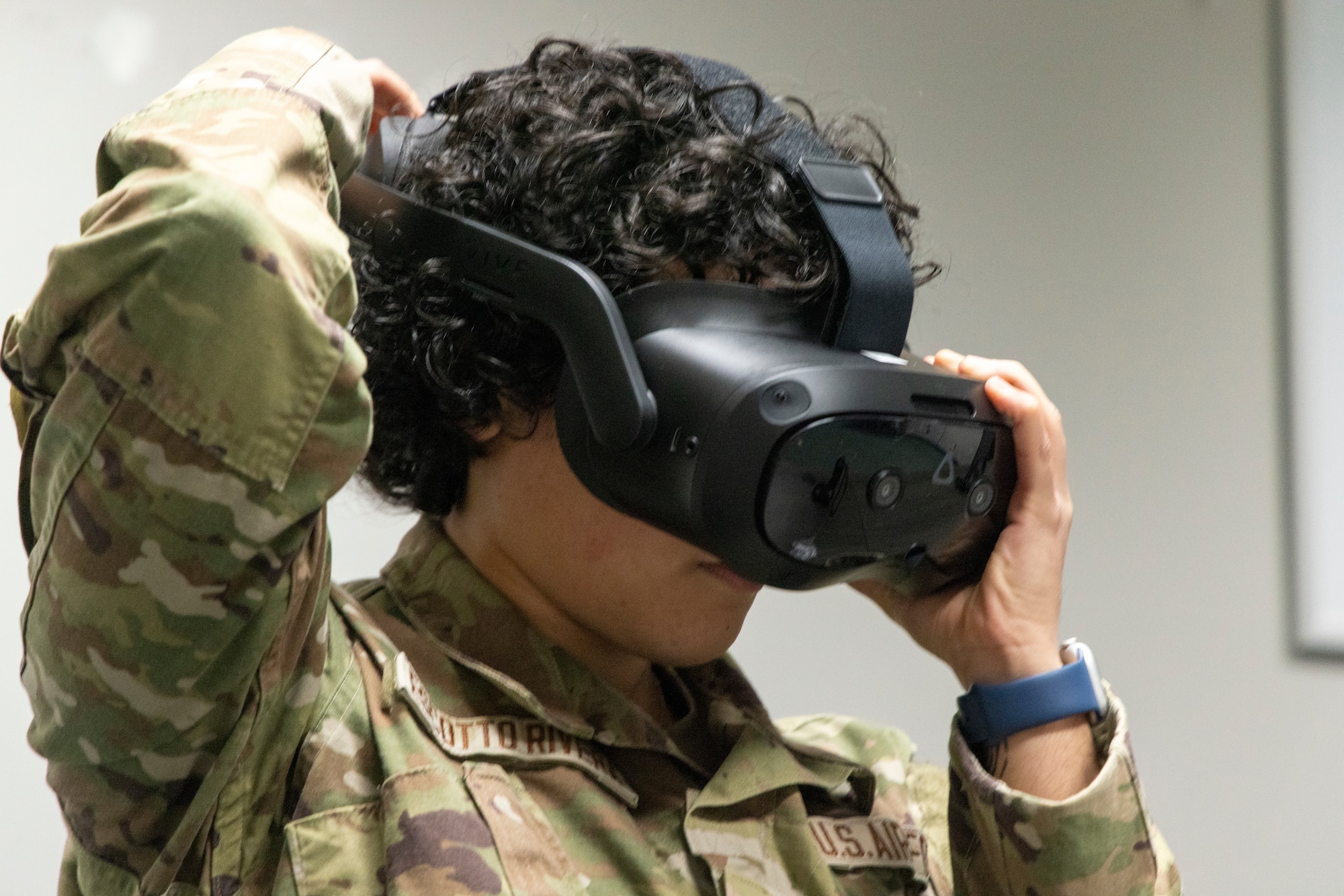 U.S. Air Force Airman Valerie Escotto-Rivera, 13th Intelligence Squadron signal intelligence analyst, puts on virtual reality (VR) headgear installed with Moth+Flame programming while taking a professional development course at Recce-U, December 12, 2025, at Beale Air Force Base, California.
