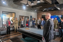 Department of War (DOW) and Department of the Army leaders tour the shared common area of Army barracks at Fort Meade, Md, Nov. 7. The visit was in support of the DOW Barracks Task Force to improve Soldier quality of life. (U.S. Army photo by Sgt. Woodlyne Escarne)