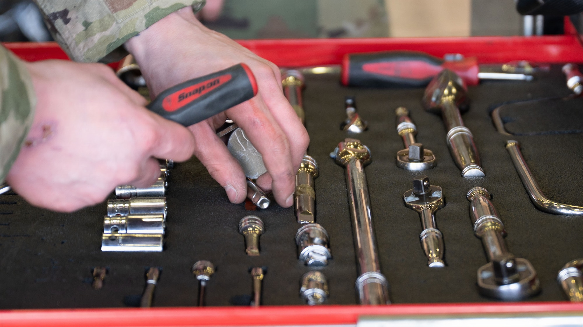 A member assigned to the 35th Fighter Generation Squadron selects tools during the 4th Quarter Ammo Bomb Build and Loading Competition at Osan Air Base, Republic of Korea, Jan. 8, 2026.