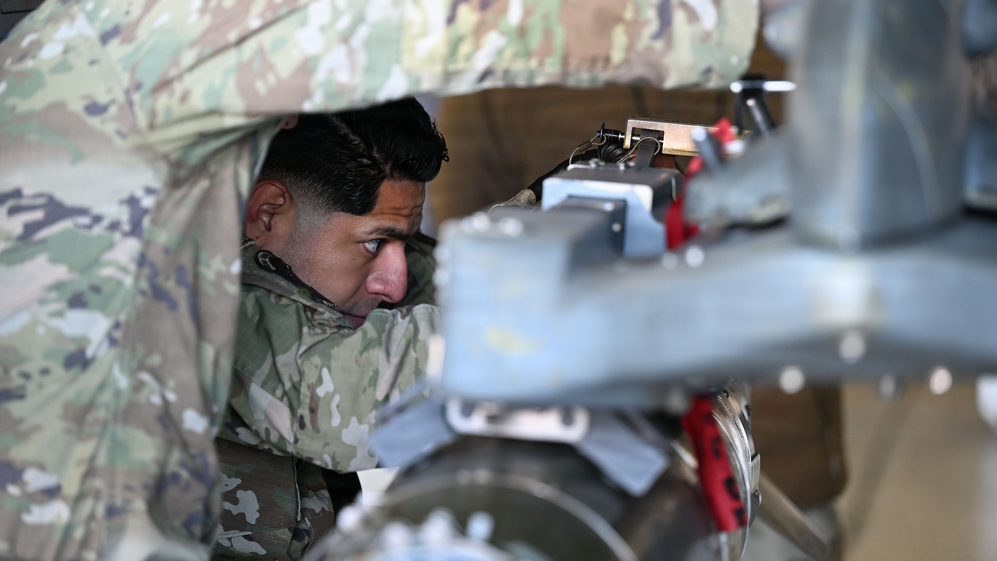 Members assigned to the 36th Fighter Generation Squadron load a bomb onto an F-16 Fighting Falcon during the 4th Quarter Ammo Bomb Building and Loading Competition at Osan Air Base, Republic of Korea, Jan. 8, 2026.