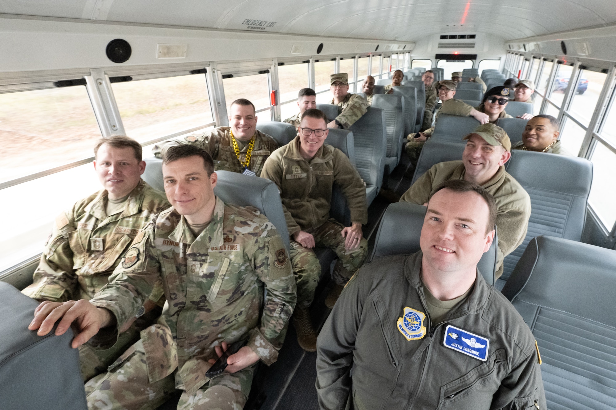 Team Dover leadership, Chief Master Sgts. and promotion selectees travel together to notify Senior Master Sgt. Ayana Hodges, Air Force Mortuary Affairs Operations programs and plans division superintendent, of her selection for promotion to the rank of Chief Master Sgt. at Dover Air Force Base, Delaware, Jan. 6, 2026. Traditionally, once a selectee has been notified, they join the group and travel with them to notify the next selectee. (U.S. Air Force photo by Mauricio Campino)