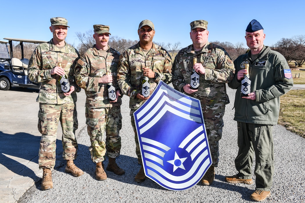 Chief Master Sgt. selects Kyle Wiens, USSTRATCOM, Nicholas Christians, 55th Strategic Communications Squadron, Daniel Schultz, 55th Security Forces Squadron, Joshua Boudinot, 55th Maintenance Squadron, and Ryan Maline, 95th Wing, pose for a photo celebrating their selection to Chief Master Sergeant at Willow Lakes golf course, Jan. 6, 2026. Out of 2,445 eligible Senior Master Sergeants across the Air Force, only 640 were selected, marking a 26.18 selection rate. This milestone reflects years of leadership, dedication, and impact on mission and people. (U.S. Air Force photo by Chad Watkins)