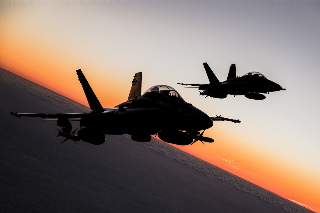 Two U.S. Marine Corps F/A-18D Hornets assigned to Marine Fighter Attack Squadron (VMFA) 232, Marine Aircraft Group 11, 3rd Marine Aircraft Wing, conduct a formation as part of Project Legacy off the coast of San Diego, March 4, 2025. The Project Legacy flight was a unique opportunity for all aircraft platforms across MAG-11 to fly as one team, practice tight formations, and take part in the documentation of a historical flight. (U.S. Marine Corps photo by Lance Cpl. Jennifer Sanchez)