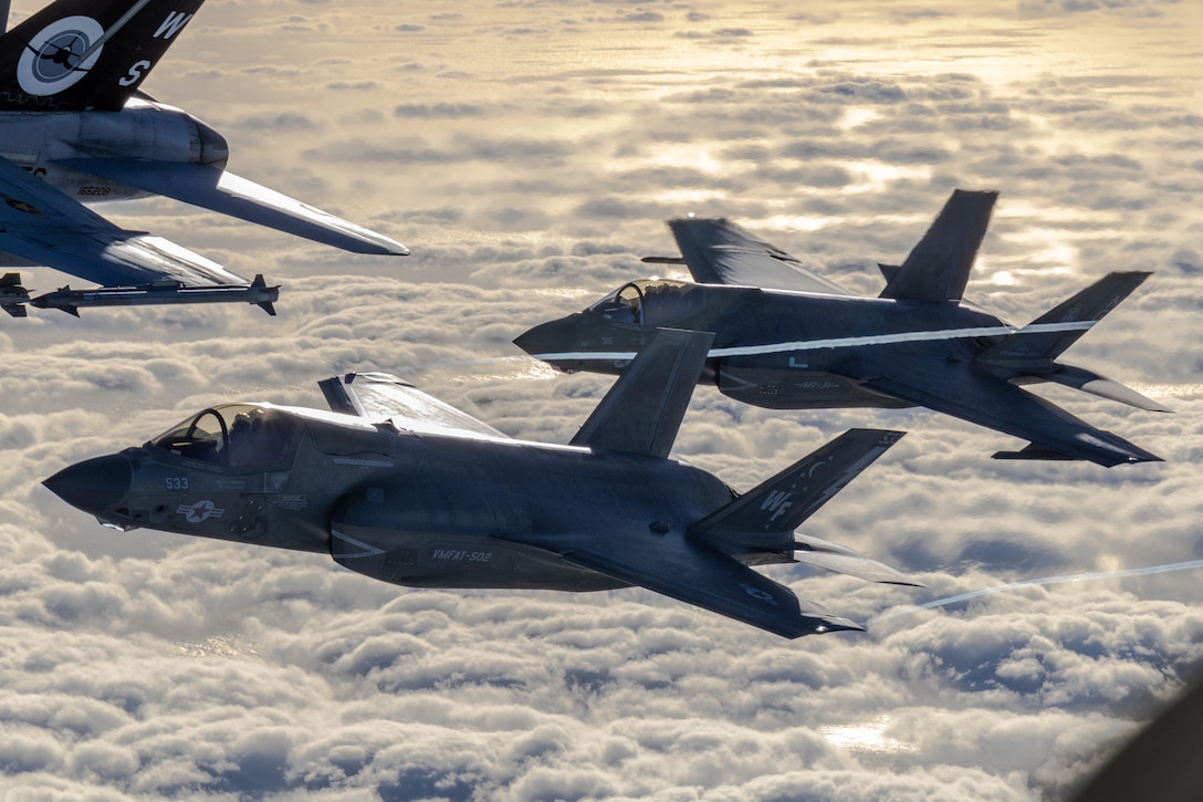 A U.S. Marine Corps F-35B Lightning II assigned to Marine Fighter Attack Training Squadron (VMFAT) 502, front, and an F-35C Lightning II assigned to Marine Fighter Attack Squadron (VMFA) 314, rear, Marine Aircraft Group 11, 3rd Marine Aircraft Wing, conduct a formation as part of Project Legacy off the coast of San Diego, March 4, 2025. The Project Legacy flight was a unique opportunity for all aircraft platforms across MAG-11 to fly as one team, practice tight formations, and take part in the documentation of a historical flight. (U.S. Marine Corps photo by Lance Cpl. Jennifer Sanchez)