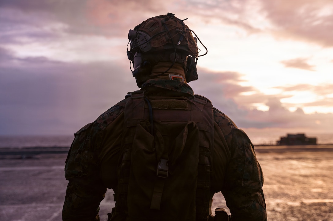 A U.S. Marine stands by on the flight deck of the world’s largest aircraft carrier, Ford-class aircraft carrier USS Gerald R. Ford (CVN 78), ahead of a right of visit boarding while underway in the Atlantic Ocean, Jan. 7, 2026. U.S. military forces are deployed to the U.S. Southern Command area of operations in support of the U.S. Southern Command mission, Department of War-directed operations, and the president’s priorities to disrupt illicit drug trafficking and protect the homeland. (U.S. Navy photo)