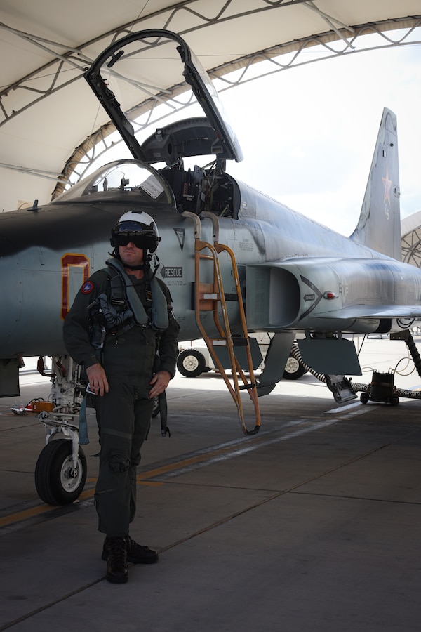 U.S. Marine Corps LtCol. Derek Heinz, director of safety and standardization, Marine Fighter Training Squadron (VMFT) 401, Marine Corps Air Station (MCAS) Yuma, prepares for a flight on MCAS Yuma, Arizona, Sept. 18, 2025. VMFT-401 is an adversary squadron of the United States Marine Corps Reserve on MCAS Yuma that flies the F-5N Tiger II. 
(U.S. Marine Corps photo by Lance Cpl. Hannah Dodson)