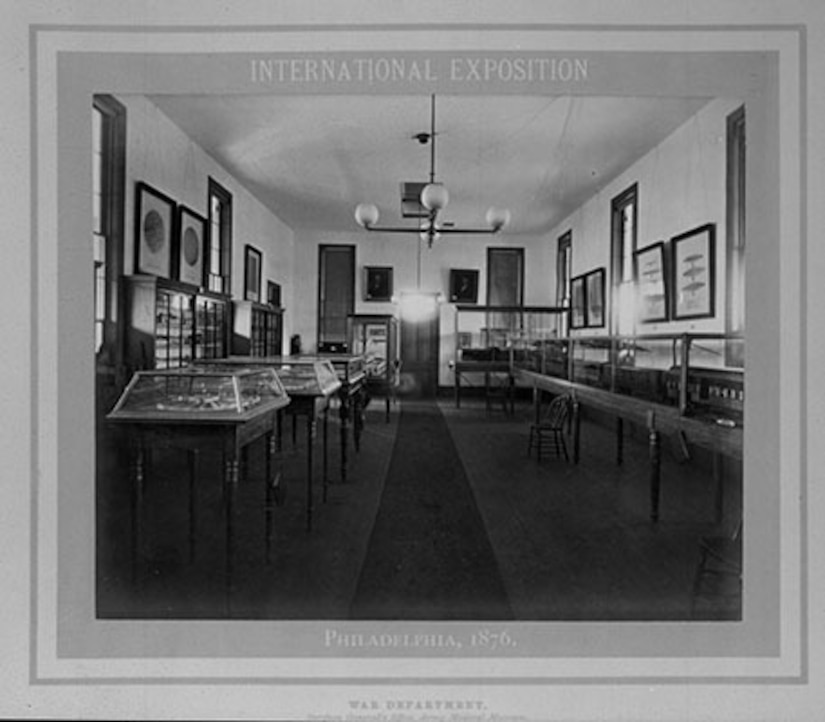 A room is shown with lines of display cases.