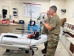 Test Players, individuals who put different technologies to the test, use the video bronchoscope on a simulation manikin at Brooke Army Medical Center on Oct. 23, 2025.