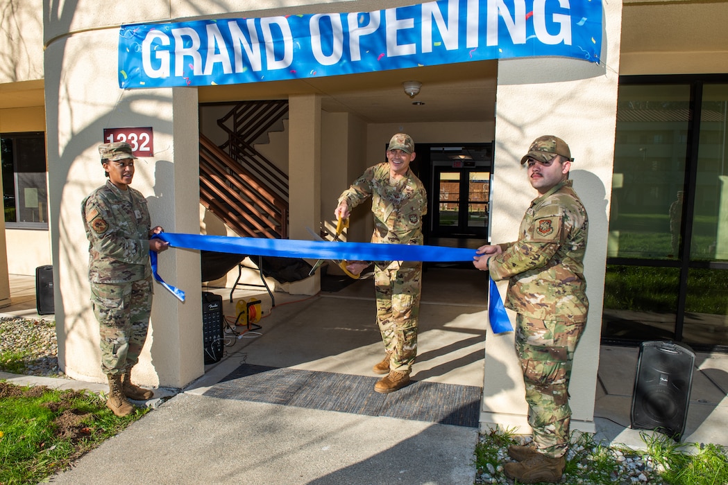 Deputy commander prepares to cut ribbon during grand opening.