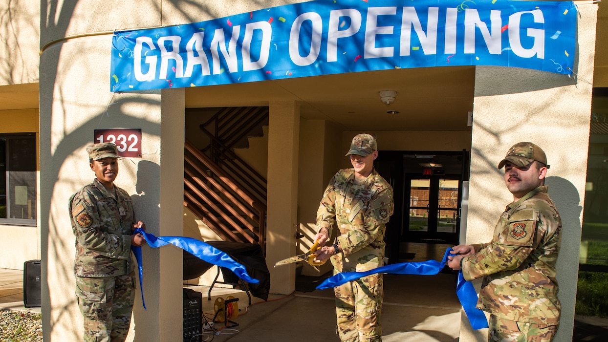 Deputy commander cuts ribbon for grand opening.