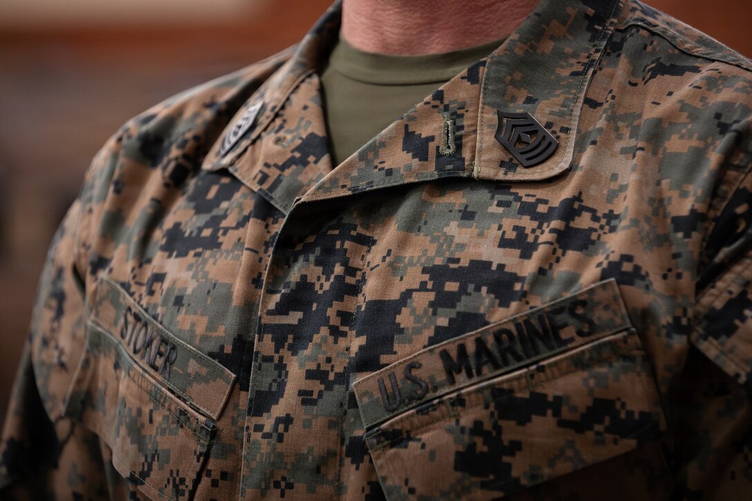 U.S. Marine Corps 1st Sgt. Joseph B. Stoker wears his new rank during a redesignation ceremony, Marine Corps Support Facility, New Orleans, Jan. 7, 2025. Stoker became one of the first Marines to laterally transfer to first sergeant through the E-8 redesignation board pilot, a new program within the Marine Corps that allows qualified master sergeants to apply for redesignation as first sergeants. (U.S. Marine Corps photo by Lance Cpl. Van Hoang)