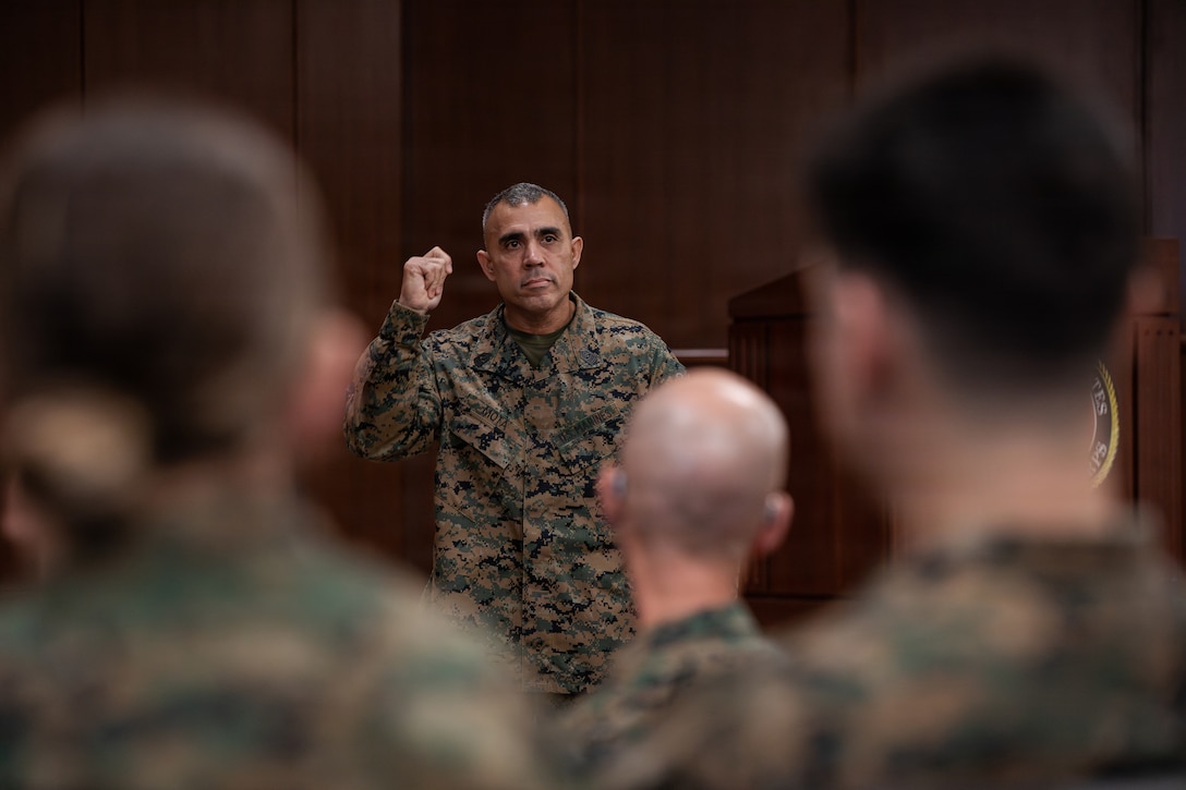 U.S. Marine Corps Sgt. Maj. Edwin A. Mota, command senior enlisted leader of Marine Forces Reserve and Marine Forces South, gives opening remarks during a redesignation ceremony for 1st Sgt. Joseph B. Stoker, an individual material readiness list coordinator with 4th Marine Aircraft Wing, Marine Corps Support Facility, New Orleans, Jan. 7, 2025. Stoker became one of the first Marines to laterally transfer to first sergeant through the E-8 redesignation board pilot, a new program within the Marine Corps that allows qualified master sergeants to apply for redesignation as first sergeants. (U.S. Marine Corps photo by Lance Cpl. Van Hoang)